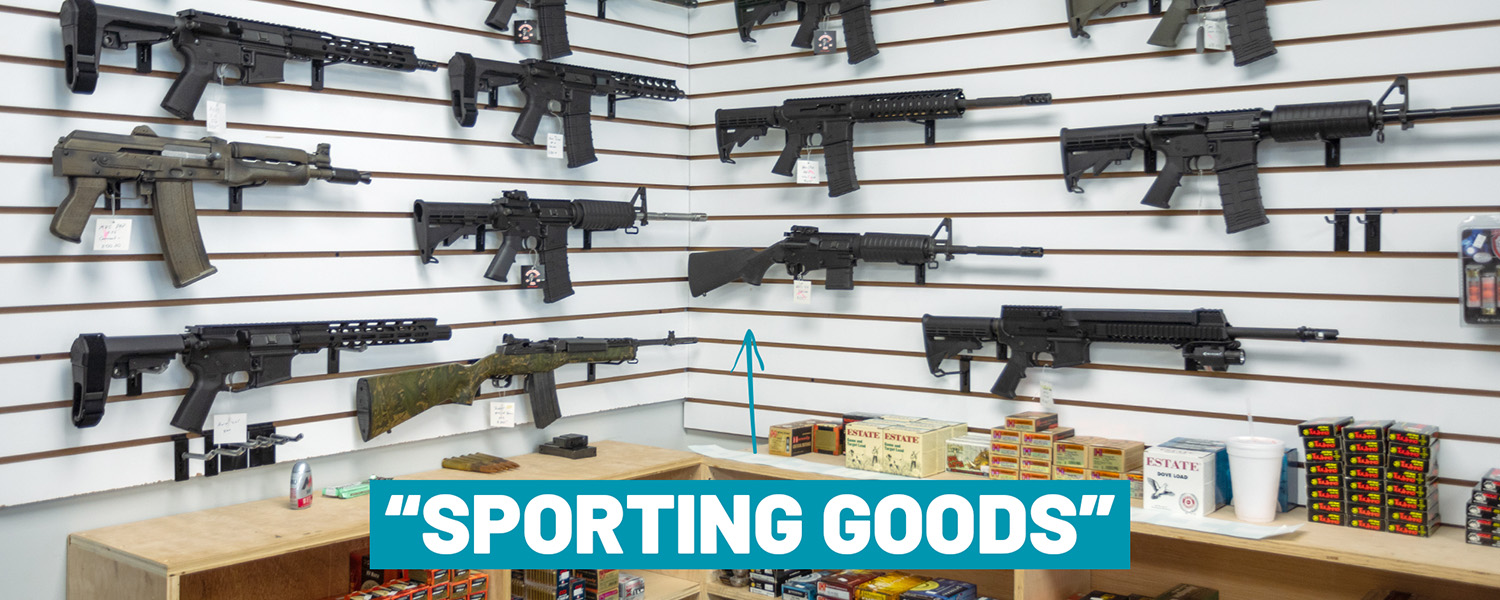 Photo of guns on the rack of a gun store labeled "sporting goods."
